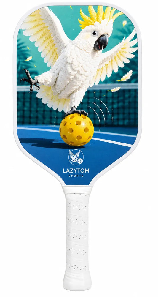 A Lazy Tom Sports pickleball paddle featuring a graphic of a white cockatoo balancing a yellow pickleball on its beak over a blue tennis court, with the LAZY TOM SPORTS logo printed near the bottom.